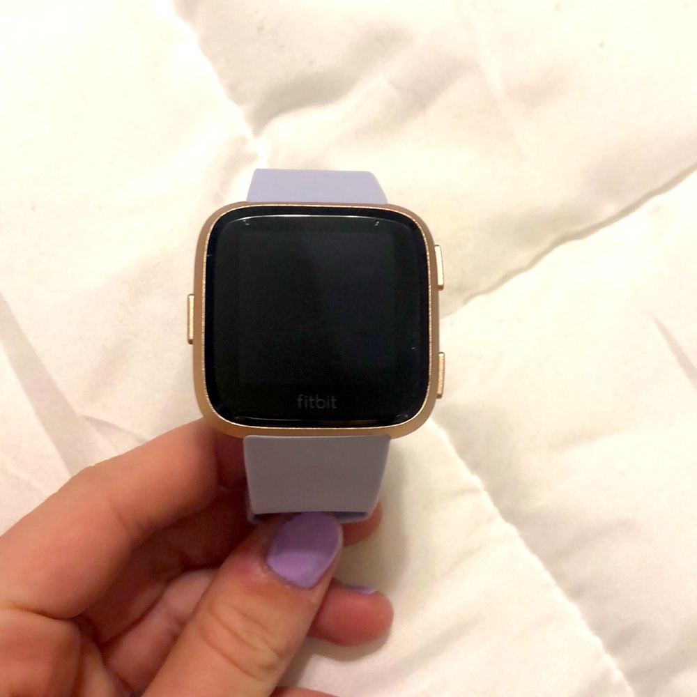 FitBit Versa, with 3 watch bands, 3 packs of wipes, and a screen protector